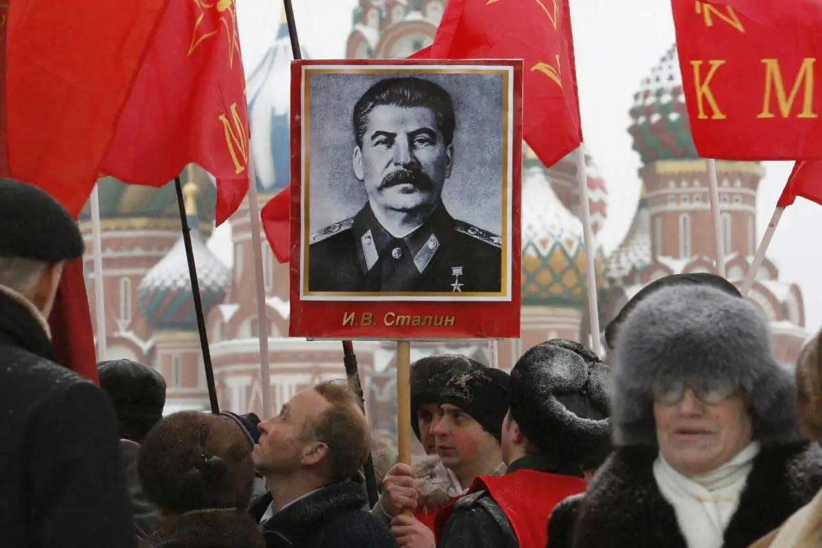 A picture of communist dictator Joseph Stalin, who ruled the Soviet Union from the late 1920s to his death in 1953, held by Russians in 2009 at a weath-laying ceremony, via Foreign Affairs